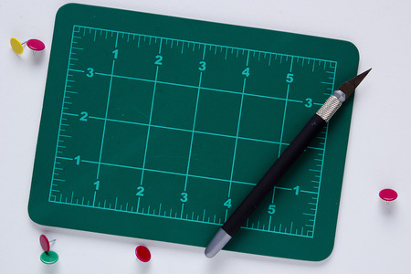 Mat with markings for cutting and a special knife.の写真素材