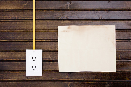 Socket with cable connected to a wooden wall.の写真素材