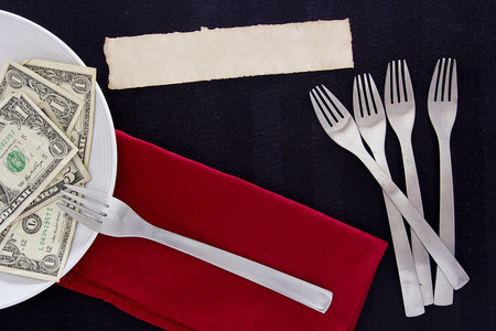 Creative with favorites using cutlery fork and money.の写真素材