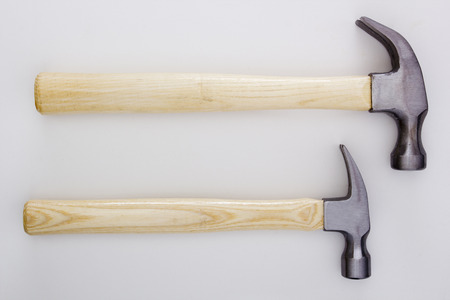 Two hammer with a wooden handle on a white background.の写真素材