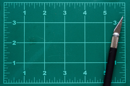 Mat with markings for cutting and a special knife.の写真素材