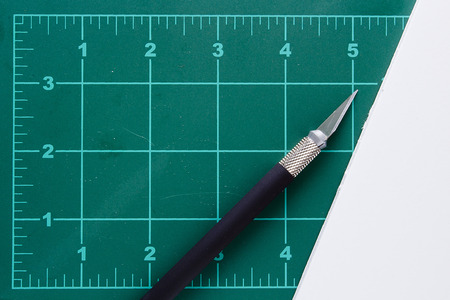 Mat with markings for cutting and a special knife.の写真素材