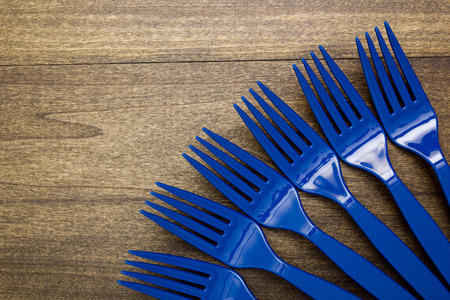 Plastic disposable fork out for a picnic.の写真素材