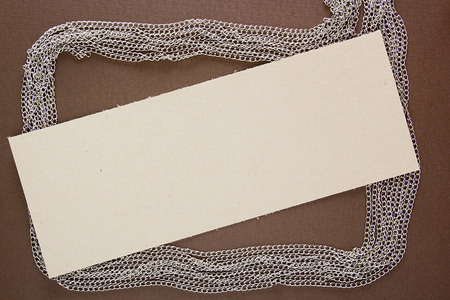 Chain jewelry and paper for informational message.の写真素材