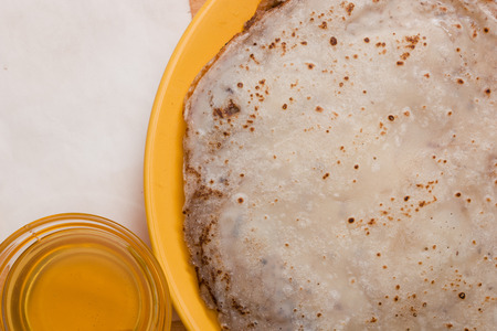 Pancakes with honey - universal food for breakfast and lunch.の写真素材