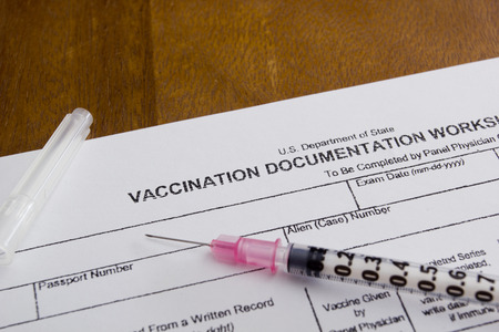 Filling in the form of vaccination. Medical records.の写真素材