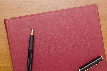 Customs Law - the book and fountain pen.