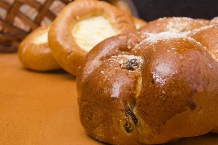 Sweet buns with raisins made from wheat flour in the form of braids.