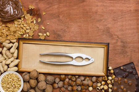 Set of various nuts with nut tongs.