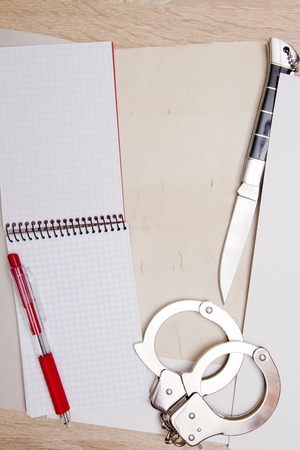 Confidential file Top Secret, with handcuffs and knife.の写真素材