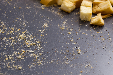 Bread crumbs on a baking sheet, roast crackers.