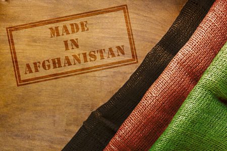 Industrial background for trade organizations in Afghanistan. Made in Afghanistan, with stylized dyed burlap in the colors of the flag of the country.の写真素材