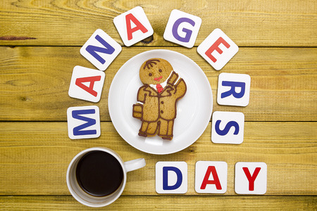 International Day of manager creative greetings with a dough biscuit.