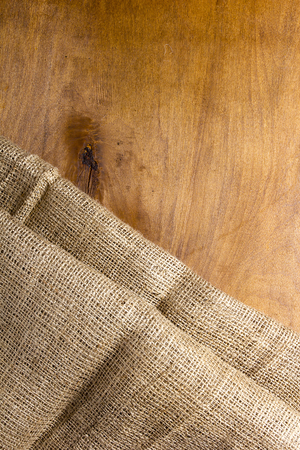 Background made of old sackcloth on wooden table or floorの写真素材