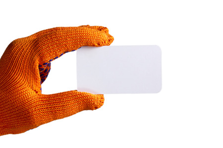 Business card in hand in orange glove on white backgroundの写真素材