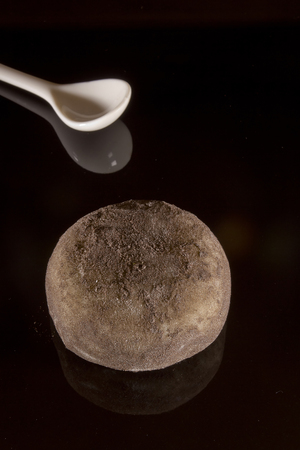 Traditional Japanese mochi dessert on a black backgroundの写真素材