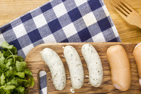 Traditional German sausages on a wooden cutting boardの写真素材