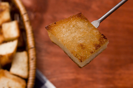 Crackers for cheese fondue on a wooden backgroundの写真素材