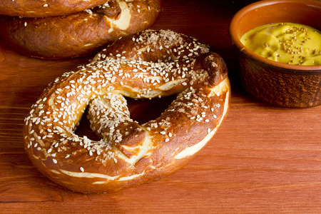German salty pretzel on a wooden backgroundの写真素材