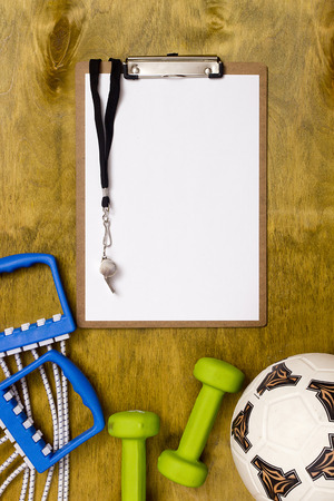 Items for the sports coach on a wooden surfaceの写真素材