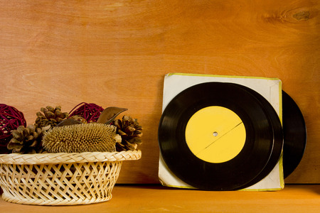 Basket with potpourri and vinyl records on a wooden backgroundの写真素材