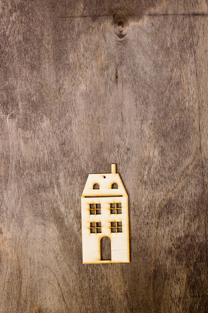 Model multistory building on a wooden backgroundの写真素材