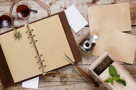 Vintage Traveler Diary with fountain pen and inkwell.の写真素材