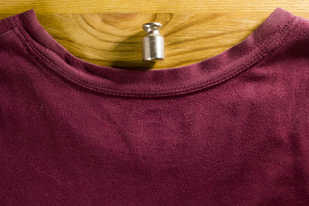 Determinants of weight on the fabric burgundyの写真素材