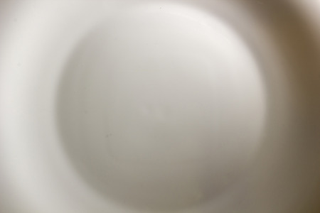 White plate as background in incomplete coverageの写真素材