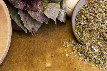Basil fresh and dry on wooden backgroundの写真素材