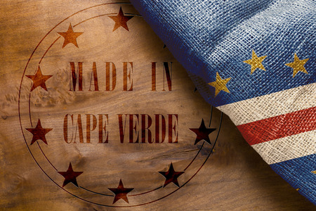 Stamp imprint of Made in Cape Verde on a wooden background.の写真素材