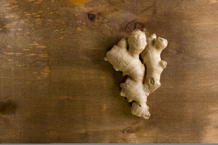 Fresh ginger root on a wooden tableの写真素材