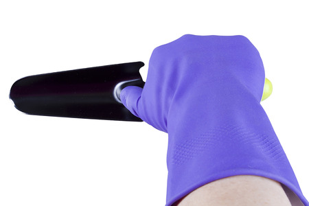 Hand in glove with garden tool on white backgroundの写真素材