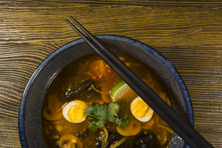 Asian ramen soup on a wooden tableの写真素材