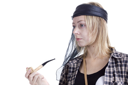 Young woman in the image of a pirate on a white backgroundの写真素材