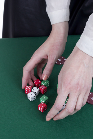 Her hands croupier with dice and chips in casinoの写真素材