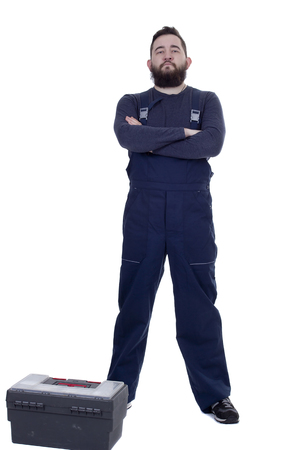 Bearded man mechanic with tool box on a white backgroundの写真素材