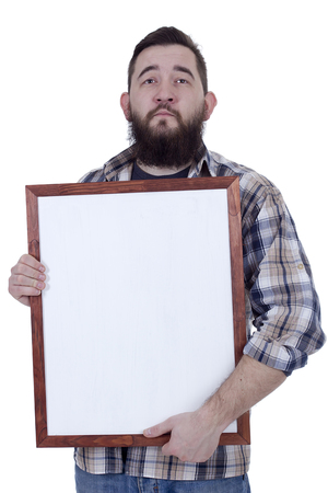 Bearded man in a plaid shirt holds a board for records on a white backgroundの写真素材