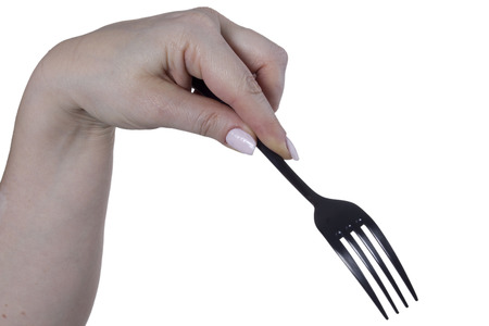 Plug in a female hand on a white backgroundの写真素材