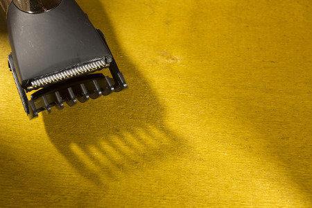 Hair clipper style on the wooden background