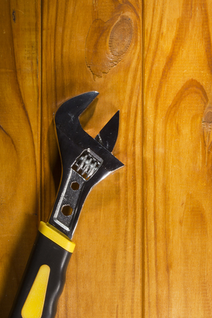New adjustable wrench on a wooden backgroundの写真素材