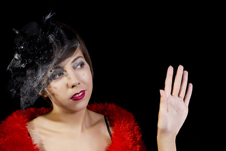 Young woman in the style of the 20s on a black background