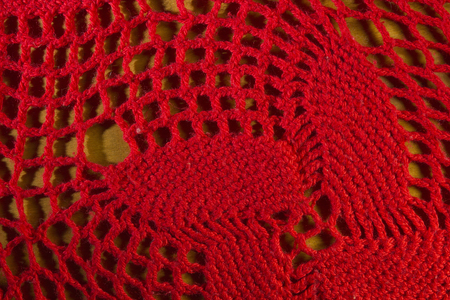 Red knitted shawl close-up in the form of a backgroundの写真素材