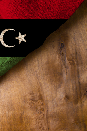 The national flag of Libya on a wooden surfaceの写真素材