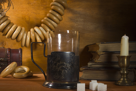 Tea in a glass with a glass holder on the deskの写真素材