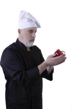 Chef with a beard and red bell pepperの写真素材