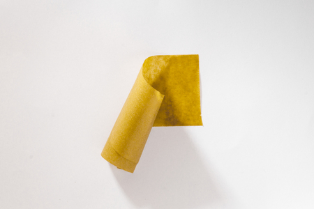 Beige masking tape on a white wall