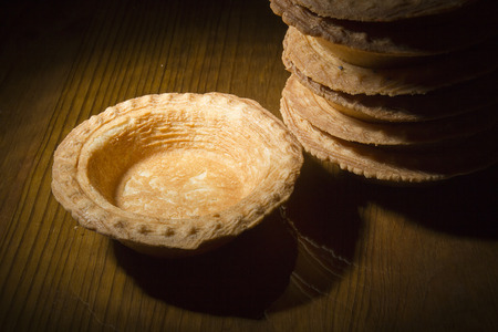 Tartlets without stuffing on a wooden table