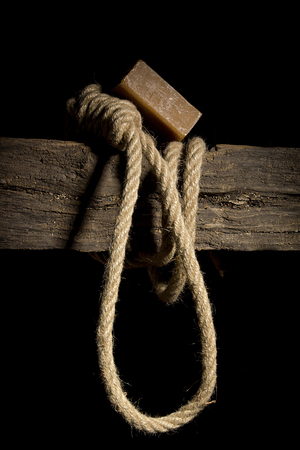 A rope loop on a wooden old crossbarの写真素材