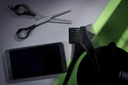 Hairdresser stylist tools on a gray-green backgroundの写真素材